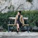 Yaritza Betancourt on bench of the coast of Amalfi Coast