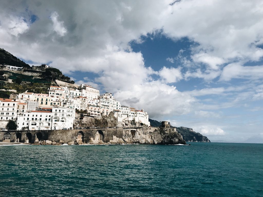 Ocean and city views of the amalfi coast from the road